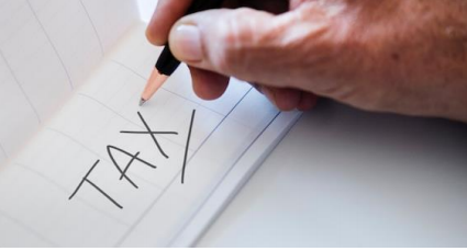 Tax text on paper image - Tax on superannuation